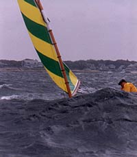 photo Beetle Cat sailing through huge waves.